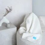 Koc z wełny merino 100% dzianinowy ecru