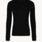 Bielizna termoaktywna z wełny merino 100% damska góra czarna, z długim rękawem. Ma ściągacze przy mankietach i małą niebieską metkę na bocznym szwie — idealna na chłodne dni, kiedy potrzeba dodatkowego ciepła.