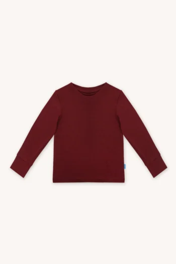 Koszulka dziecięca z długim rękawem z wełny merino w kolorze bordowym. Przód koszulki