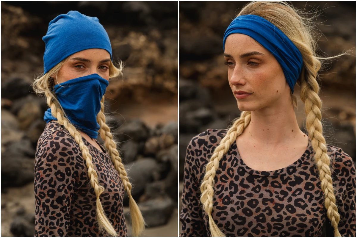 Kobieta z długimi blond warkoczami nosi niebieską chustę stylizowaną na zakrywającą twarz na jednym zdjęciu i opaskę na innym. Ubrana jest w bluzkę w panterkę i stoi na zewnątrz ze skałami w tle.